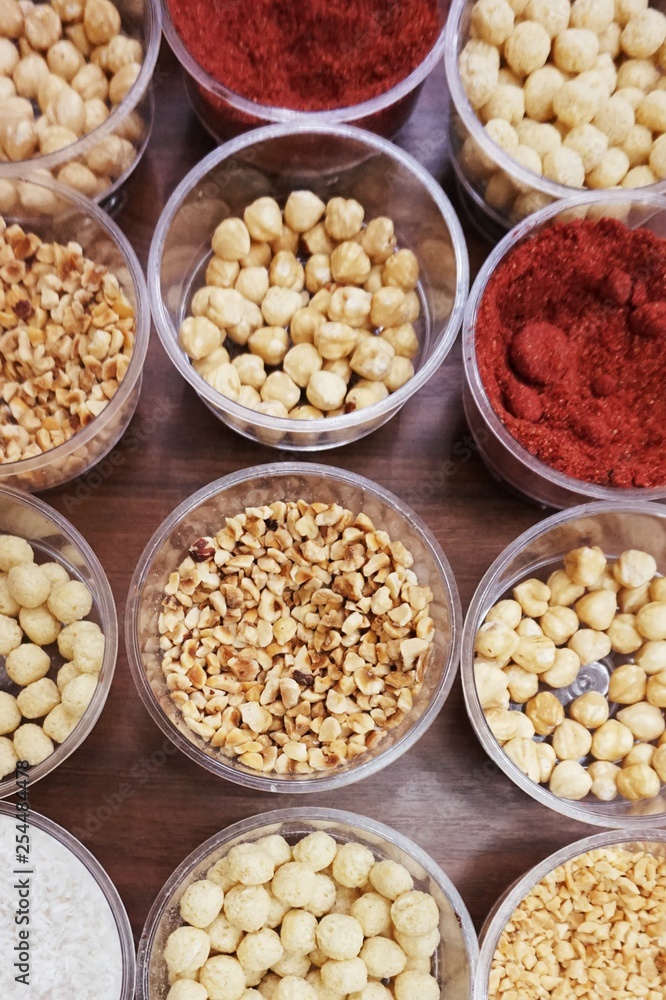 Various spices, nuts and additives on the table. Various spices, nuts and additives on the table.