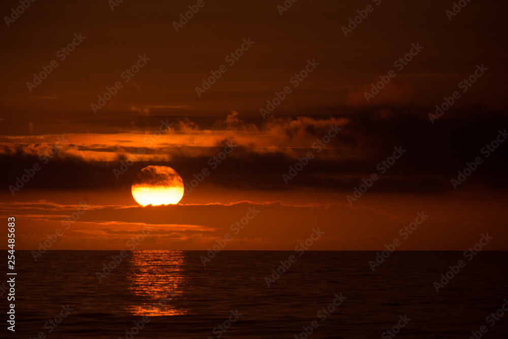 Sun behind clouds on a fired sky 6 Sun behind clouds on a fired sky 6