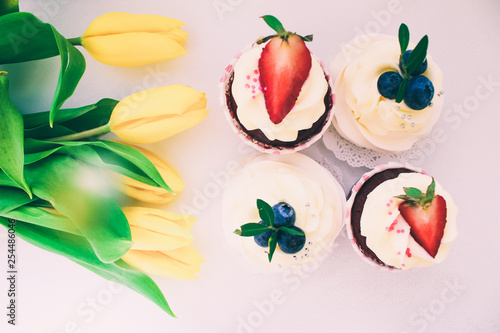 Fototapeta Naklejka Na Ścianę i Meble -  Cupcakes in shape of number 8 with tulip flowers on pink pastel background. International Women's Day concept, March 8.