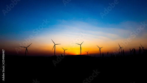 Landscape photo Wind turbines silhouette at sunset 