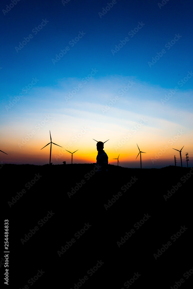 Silhouette of Man happy at sunset