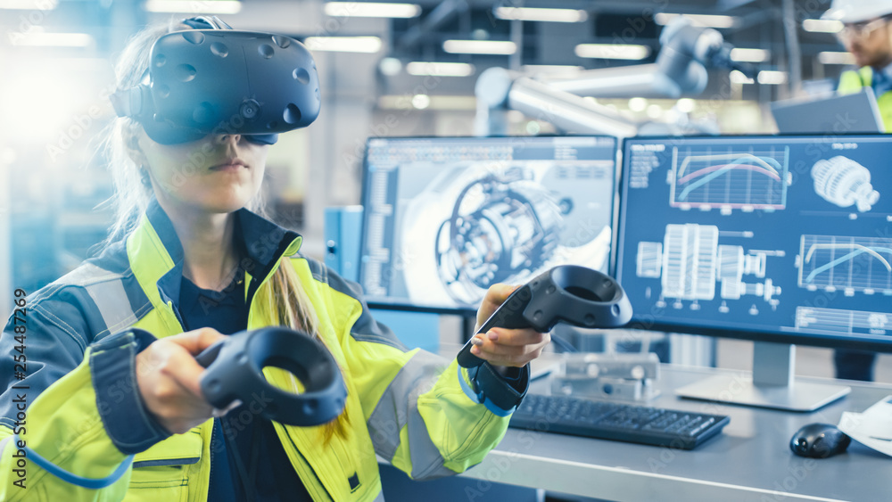 Factory: Female Industrial Engineer Wearing Virtual Reality Headset and  Holding Controllers, She Uses VR technology for Industrial Design,  Development and Prototyping in CAD Software. Stock Photo | Adobe Stock