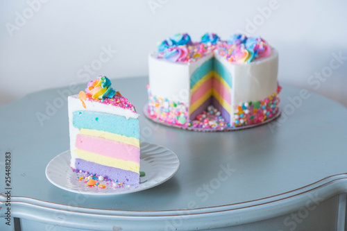 Rainbow layered cake with sprinkles