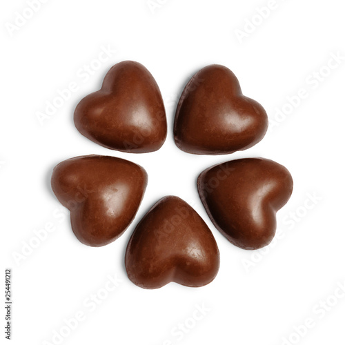 Five chocolate hearts candies isolated on white backround