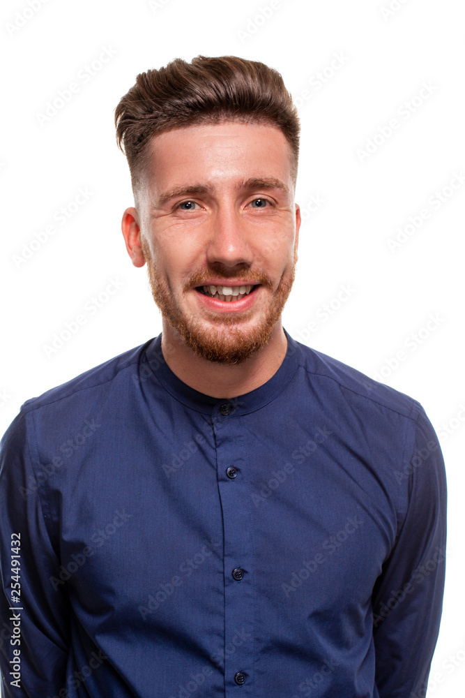 Attractive young man wearing blue shirt, isolated over a white background.
