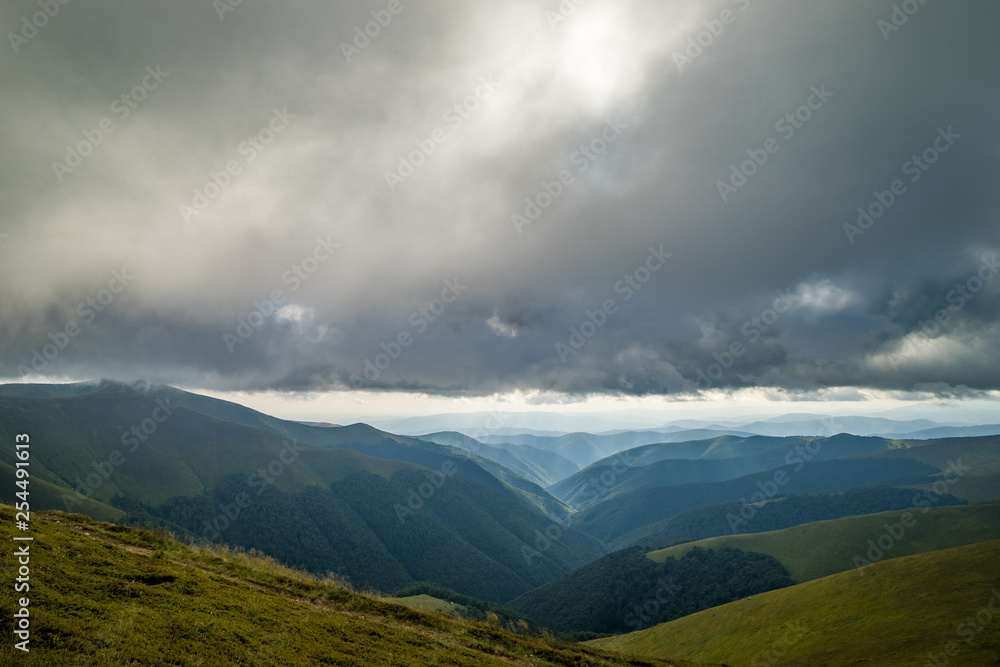 Rain clouds above Carpathians. Panorama of Borzhava ridge of the Ukrainian Carpathian Mountains