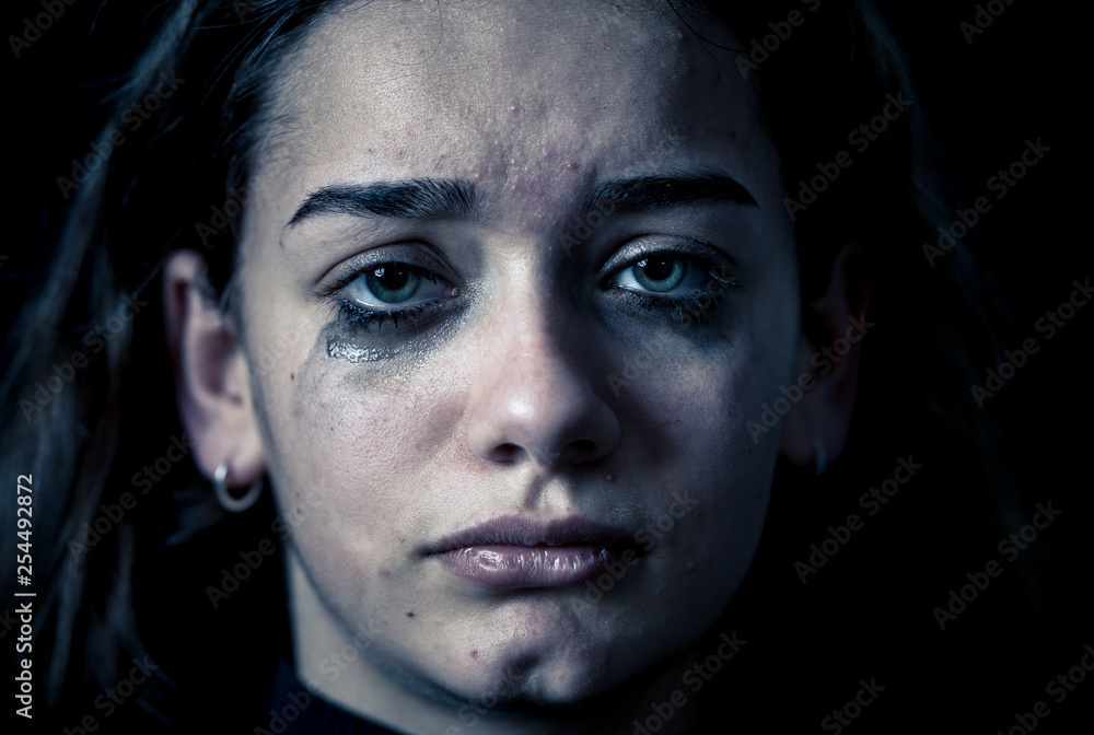 Portrait of sad, unhappy young girl crying. Helpless, depressed child. Stop bullying campaign Portrait of sad, unhappy young girl crying. Helpless, depressed child. Stop bullying campaign
