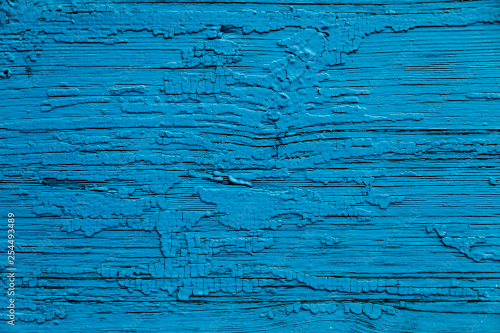 Obraz premium The wooden wall of an old Christian temple. Blu wooden wall background, vintage wooden background. 