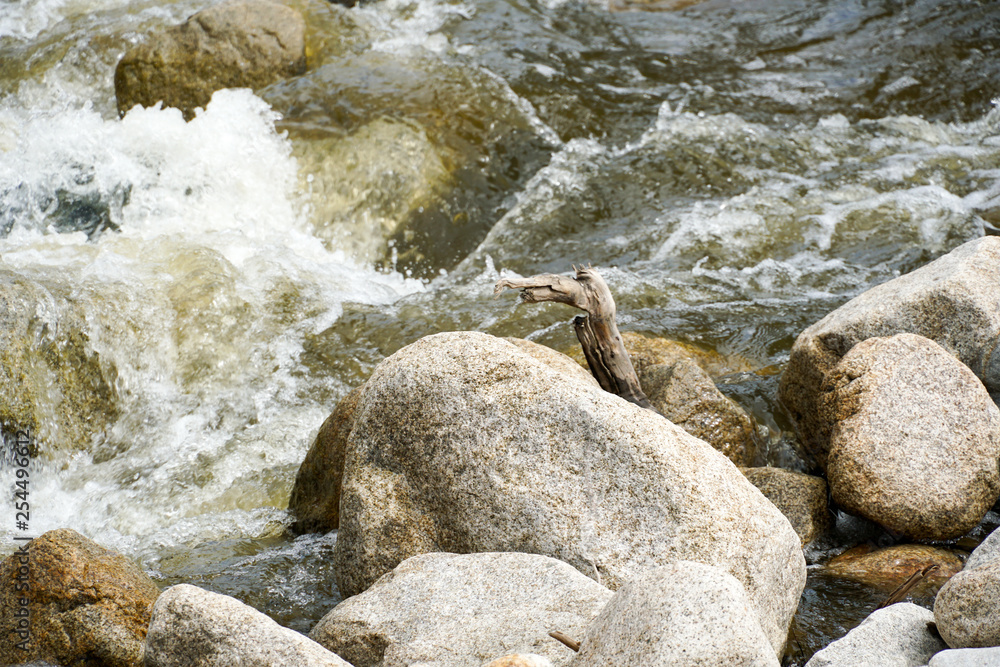 Close up fast flowing water between rocks in the mountain, small rocks cascade. Walker Canyon, California, San Diego. Close up fast flowing water between rocks in the mountain, small rocks cascade. Walker Canyon, California, San Diego.