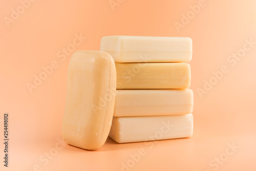 pieces of natural soap isolated on the orange background
