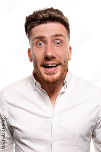 Studio photo of a good-looking man in a white shirt, isolated over a white background