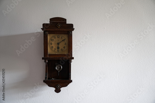Vintage clock whith time on the wall