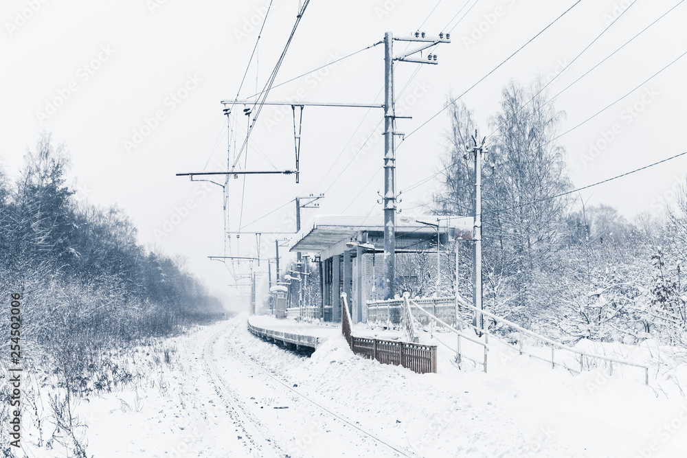 Winter landscape with empty railway station Winter landscape with empty railway station