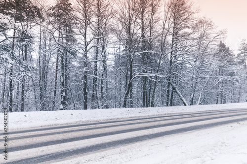 Winter landscape with an empty highway photo