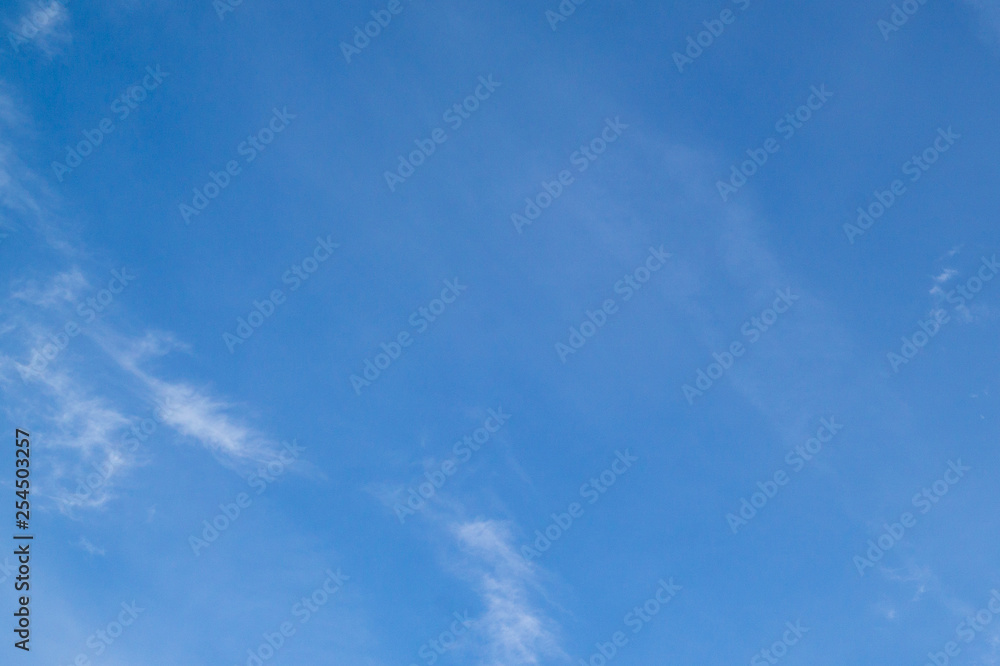 Blue sky with clouds and sun reflection in water with place for your text. blue sky background with white clouds Blue sky with clouds and sun reflection in water with place for your text. blue sky background with white clouds