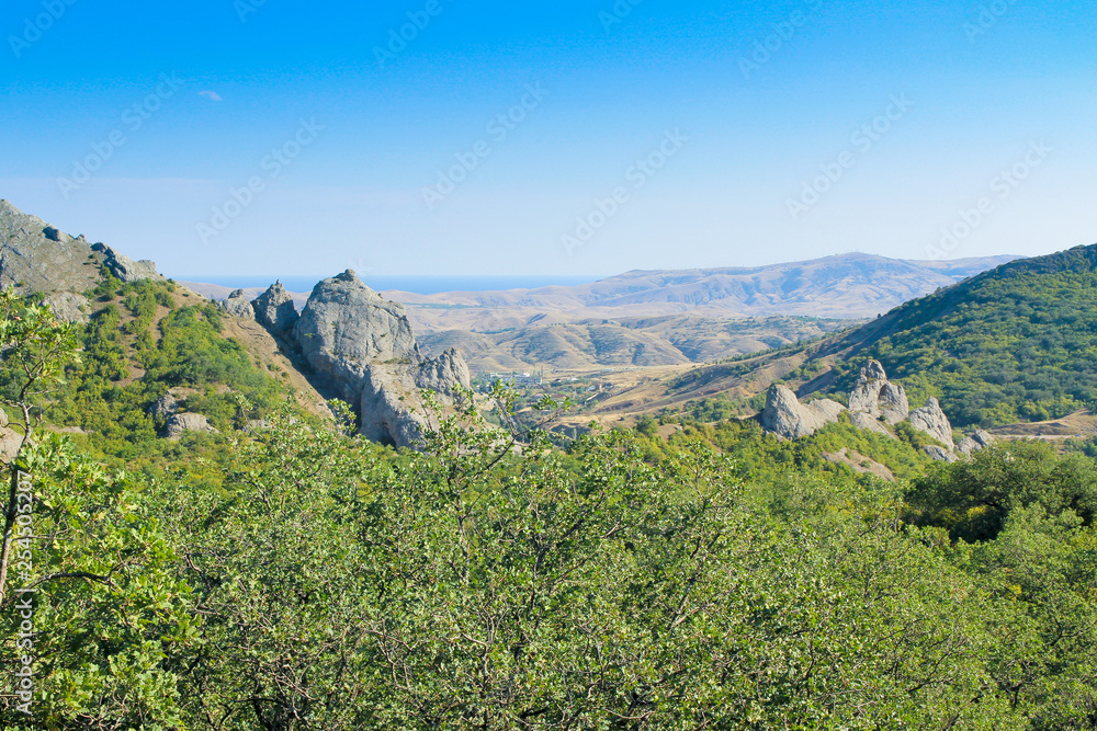 Obraz premium Landscape. Mountains, forest, sea and blue sky
