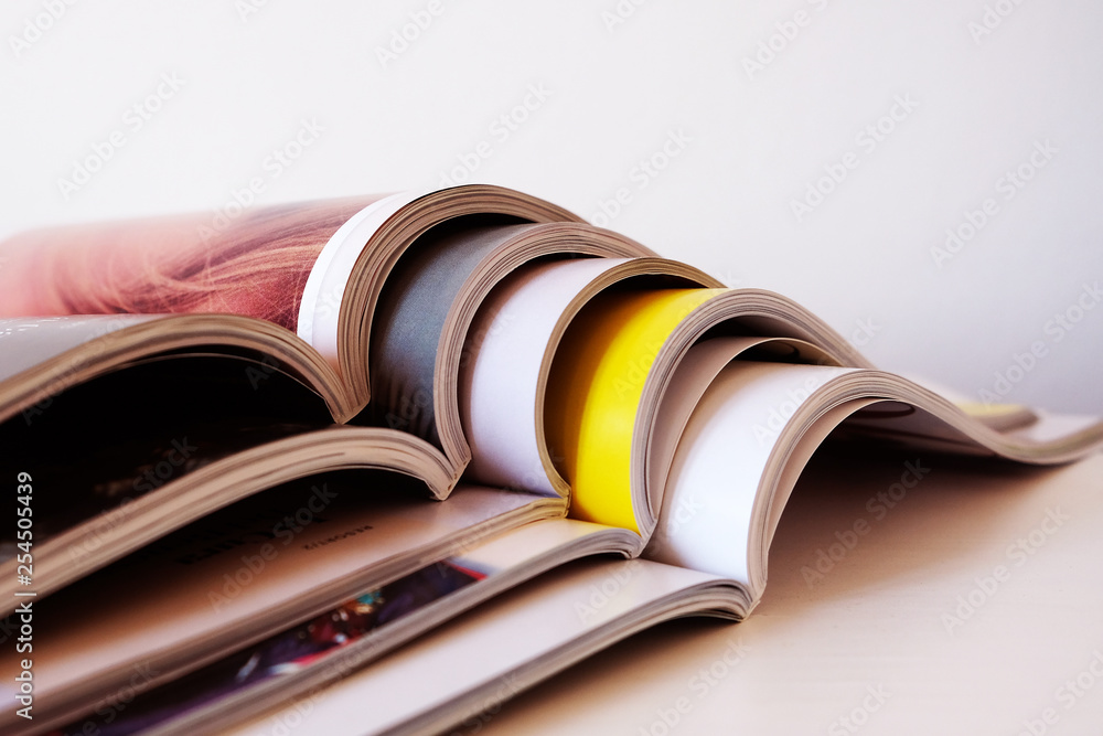 Obraz na plátně Stack of open magazines
