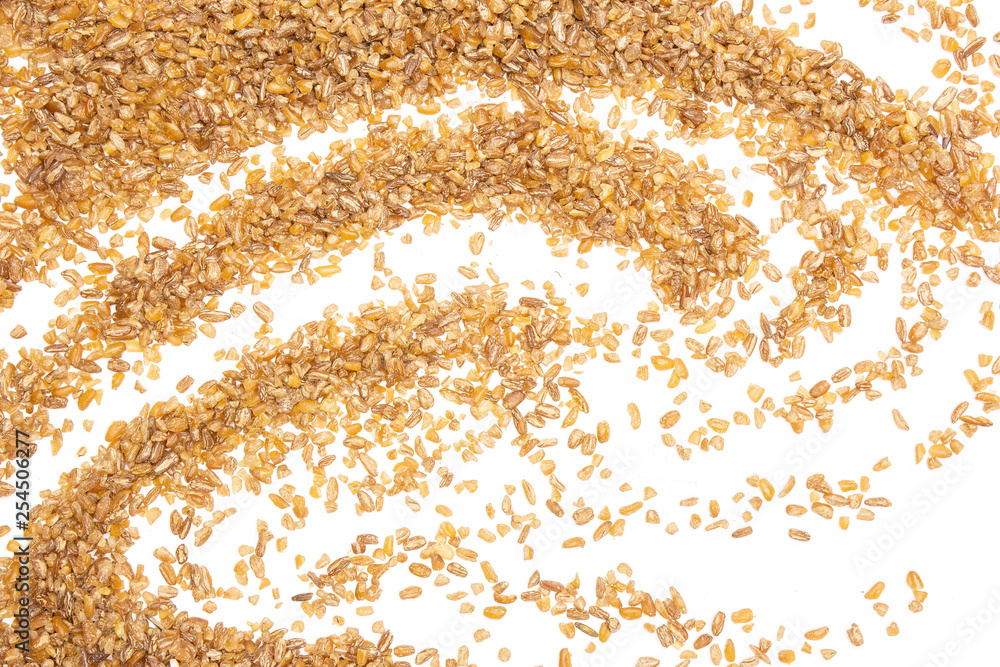 Lot of whole raw bulgur grains waving flatlay isolated on white background Lot of whole raw bulgur grains waving flatlay isolated on white background