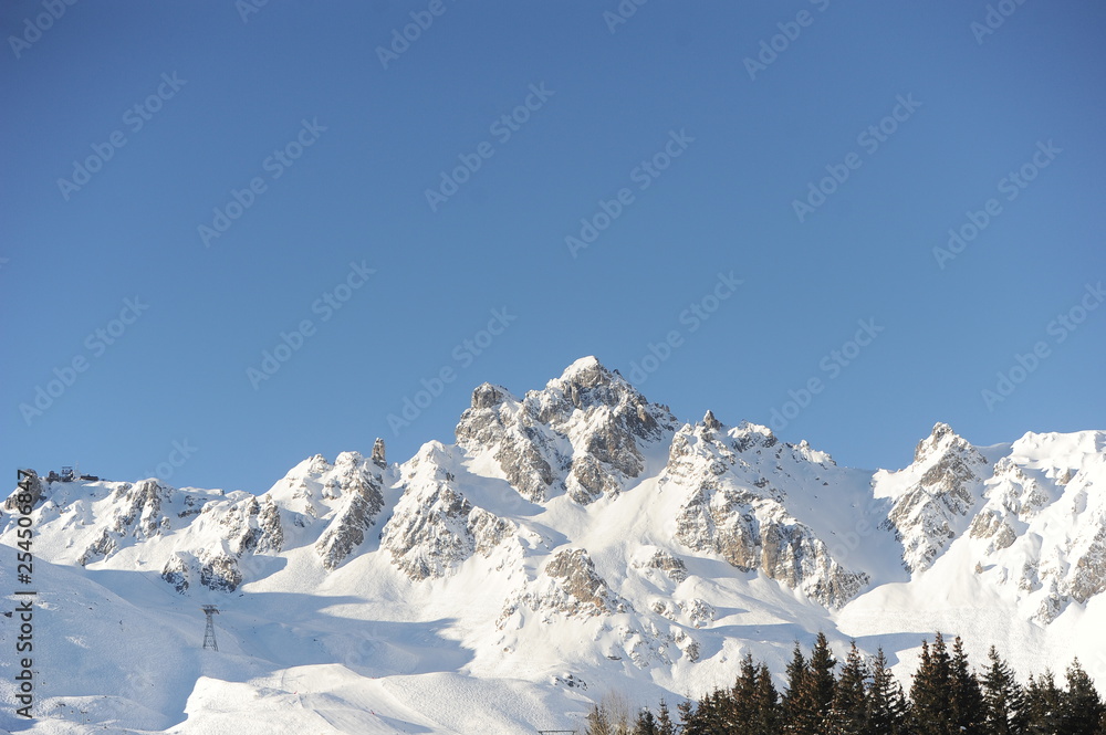 Winter scenery with mountain peak and snow