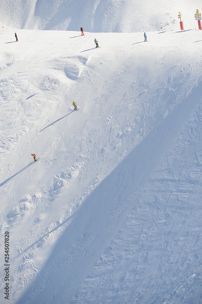 Skiing people in winter at black slope Skiing people in winter at black slope