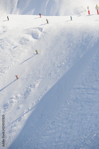 Skiing people in winter at black slope