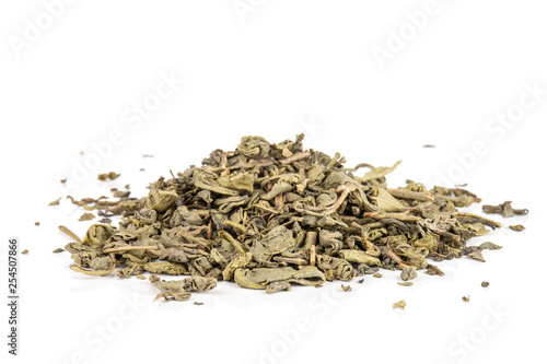 Lot of pieces of dry green tea heap isolated on white background