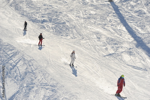 Skiing people in ski resort 