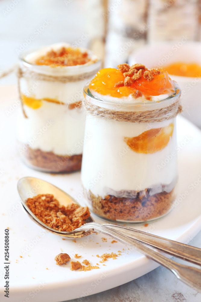 Mini cheesecake with apricots in two cups Mini cheesecake with apricots in two cups