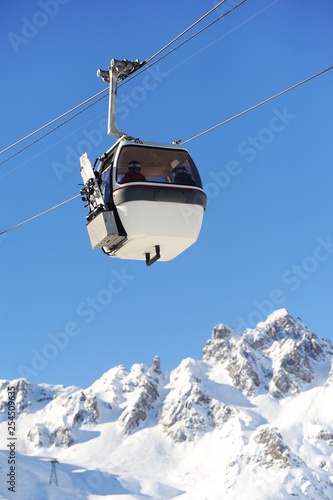 Ski lift in mountain with winter background 