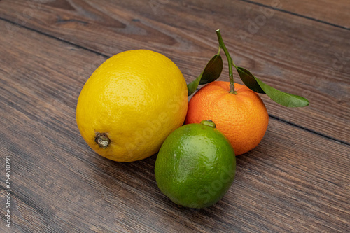 Lemon, Lime and Mandarin on a Wooden Table
