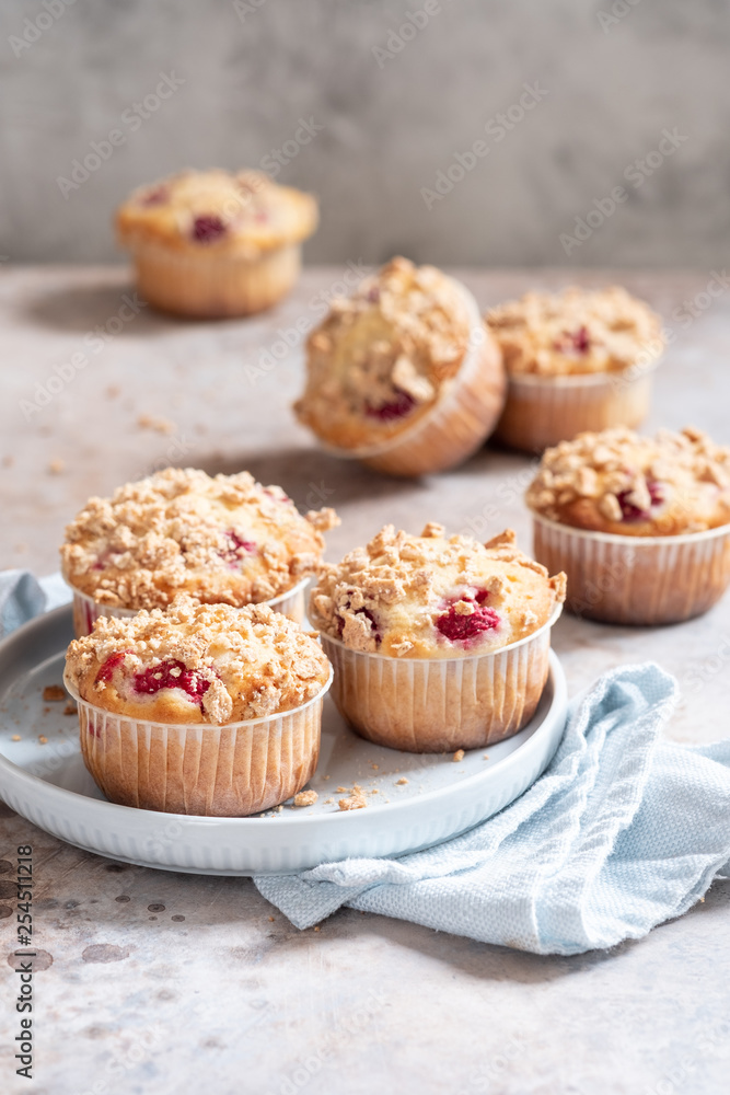 Fresh homemade delicious raspberry muffins on a table Fresh homemade delicious raspberry muffins on a table