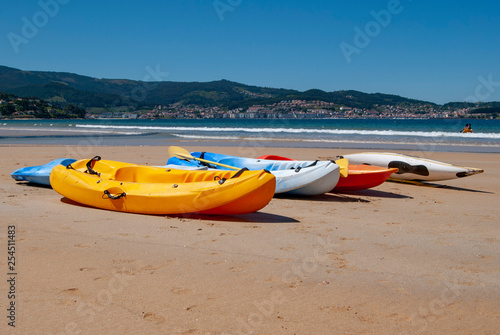 Canoes on sunny beach