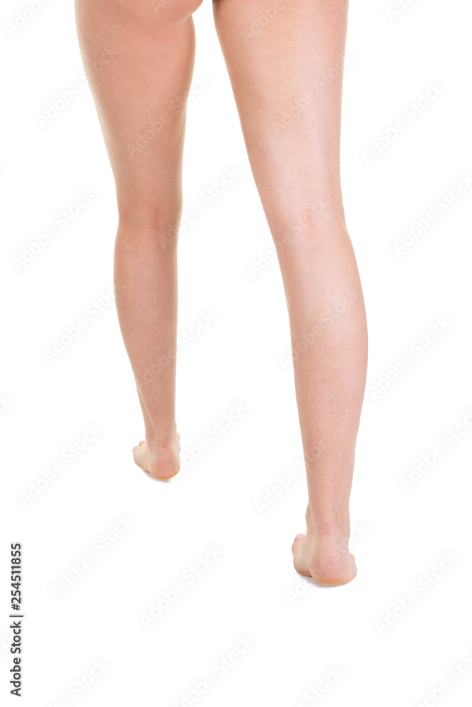 Back view of smooth woman legs and feet walking Back view of smooth woman legs and feet walking