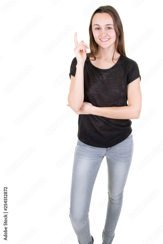 Happy woman standing full lenght pointing and presenting at side looking at camera Happy woman standing full lenght pointing and presenting at side looking at camera