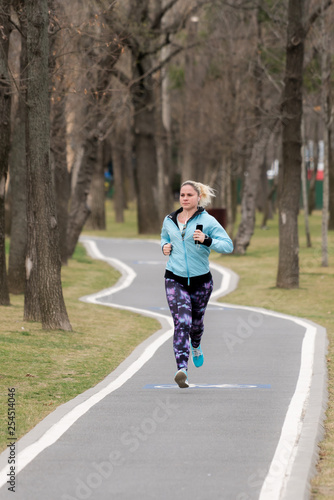 young girl in the park jogging