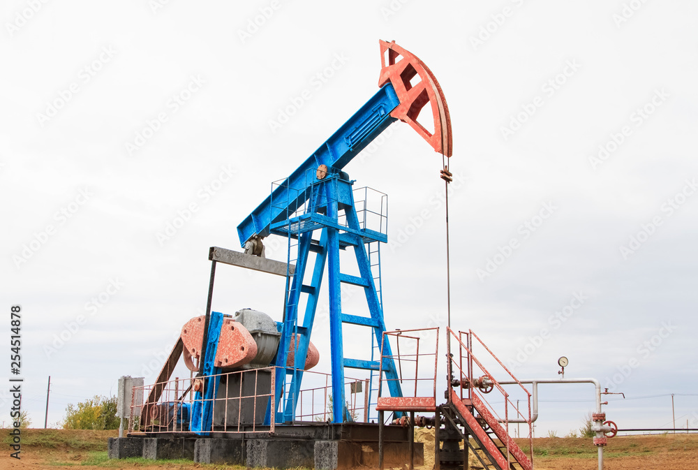 Work of oil pump jack on a oil field Work of oil pump jack on a oil field
