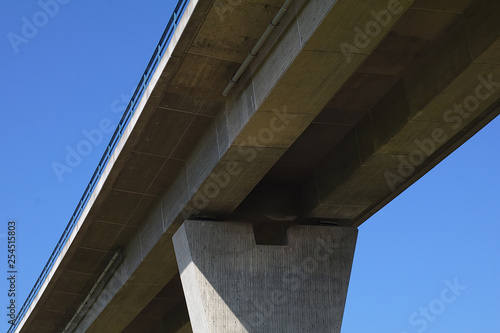 low-angle photo of concrete bridge