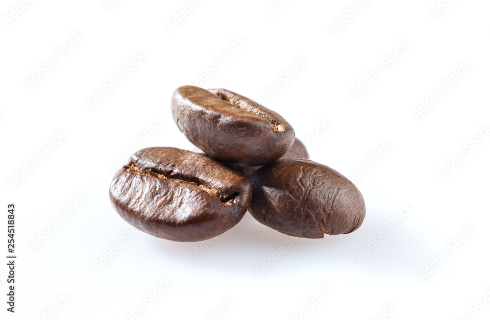 Roasted coffee beans close-up isolated on white background. Roasted coffee beans close-up isolated on white background.