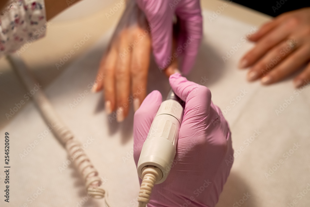 Obraz premium Hardware manicure . Hands of an adult woman. Age manicure