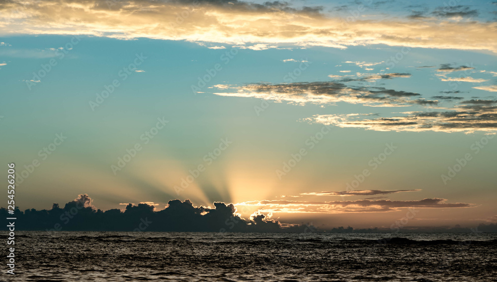 Clouds and rays at the Sunset on the horizon in Madeira Beach, Florida