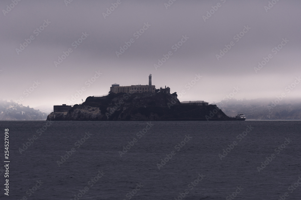Morning fog clears around Alcatraz Island in San Francisco