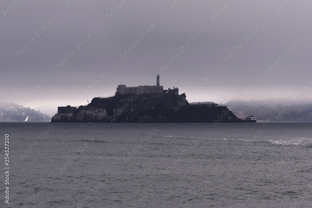 Morning fog clears around Alcatraz Island in San Francisco