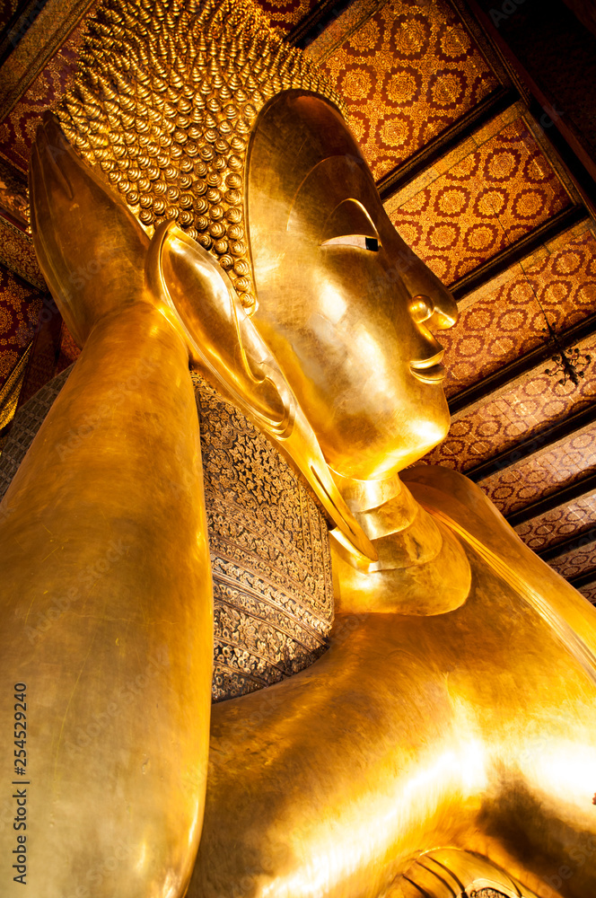 gold lying Buddha