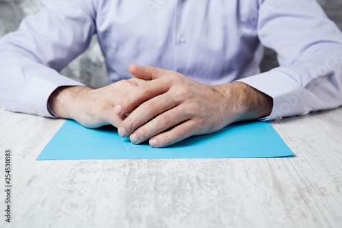 man hand cross on desk