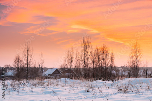Wooden Houses At Winter Sunset Dawn Sunrise Time