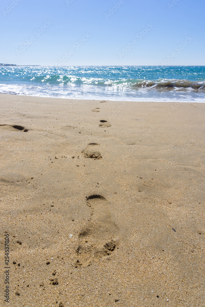 footprint on the sand coming out of the sea footprint on the sand coming out of the sea