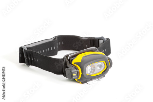 Head lamp flashlight with light beam studio shot