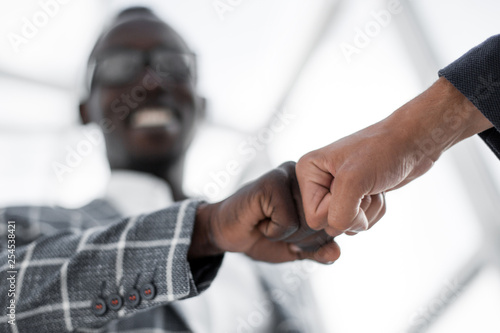 Business people showing Fist Bump after meeting