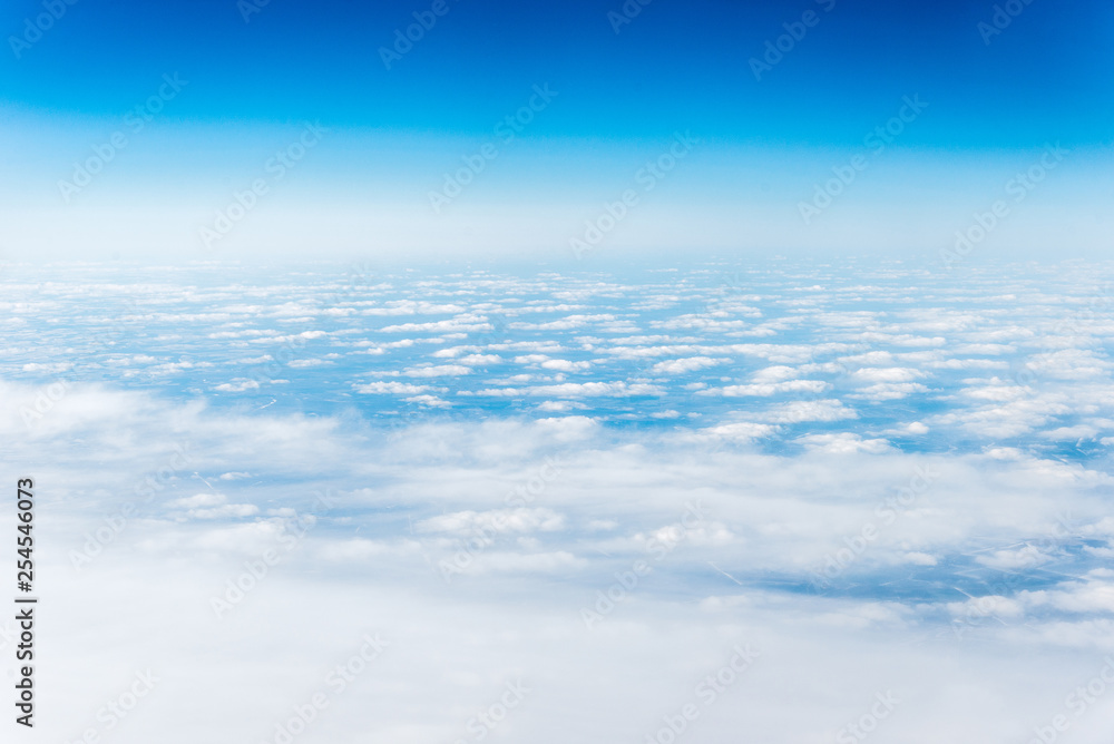 Top view of white clouds above the ground or water Top view of white clouds above the ground or water