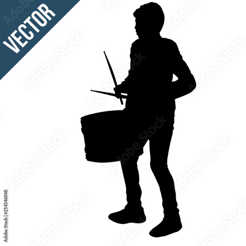 Boy silhouette playing a drum